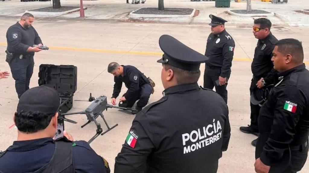 Monterrey police officers in black uniforms stand around a drone and equipment on a paved area preparing or demonstrating in a briefing setting   Informe Regio