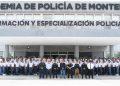 Group photo of police academy recruits and instructors standing in front of a training center with signs reading Formación y Especialización Policial above the entrance   Informe Regio