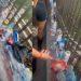 Littered sidewalk along a railing with plastic bottles cans and wrappers scattered on the ground   Informe Regio