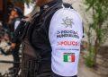 Close up of a police officers white sleeve with Policía Mundialista and a Mexican flag patch   Informe Regio