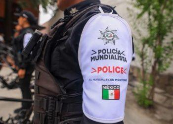 Close up of a police officers white sleeve with Policía Mundialista and a Mexican flag patch   Informe Regio