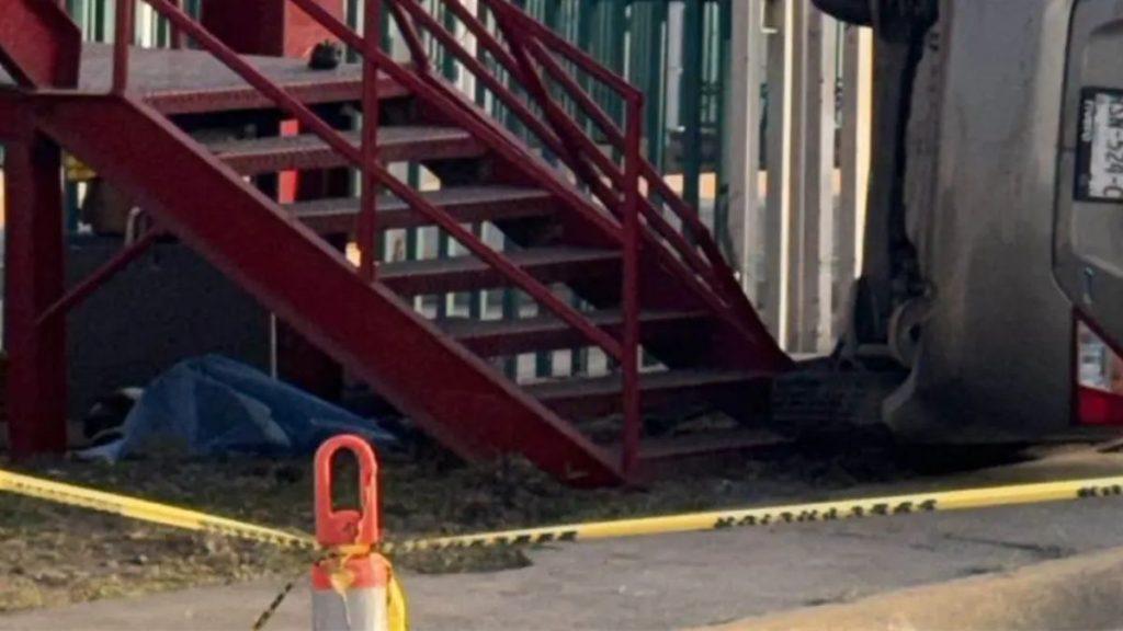 Overturned vehicle beside a red metal staircase with yellow caution tape in the foreground indicating a restricted crash scene area​   Informe Regio