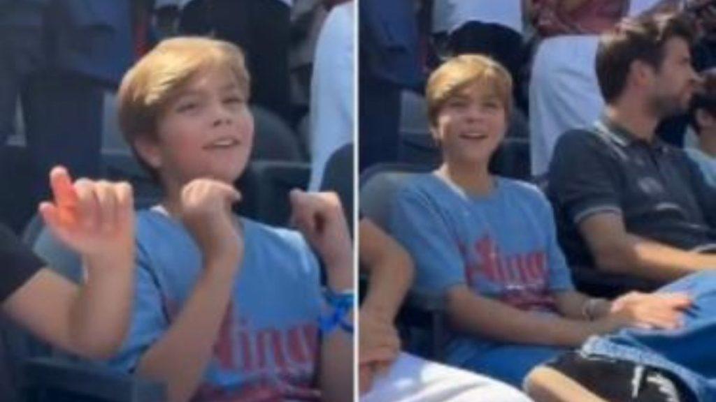 Pique-mundial-hijos-shakira - Informe Regio Boy with blond hair in a blue Tshirt raising his hands in a stadium audience looking up Informe Regio
