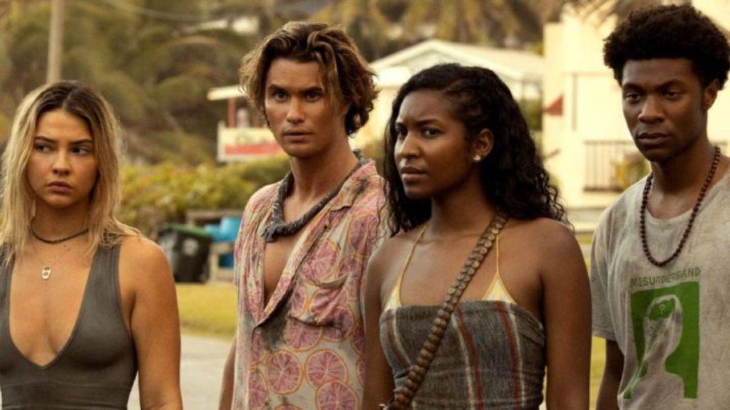 Outer-banks-elenco-netflix 1 - Informe Regio Four young adults standing outdoors looking serious and focused at something off screen Informe Regio