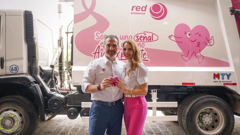 Man and woman in white shirts pose in front of a pink promotional truck holding a pink heart object   Informe Regio