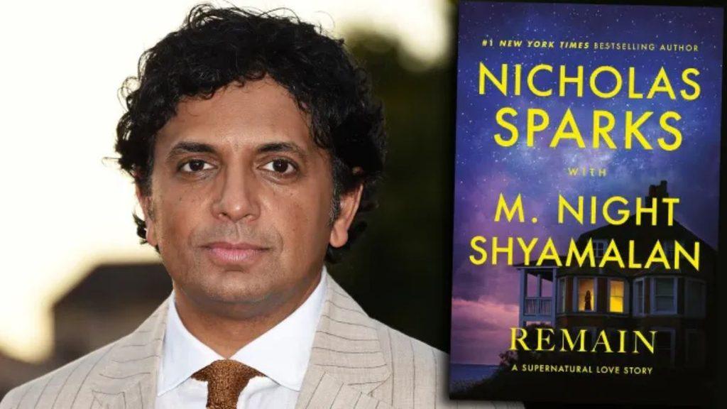 Portrait of a man in a light pinstripe suit and orange tie standing beside a blue book cover that reads Remain by Nicholas Sparks with M Night Shyamalan   Informe Regio